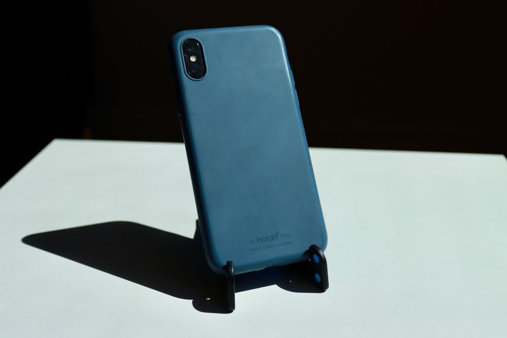 A phone stand holding a smartphone upright